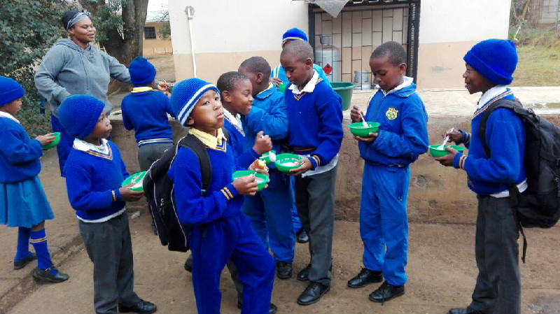 Learners at Howick Cosmo Primary enjoy a morning bowl of the Al-Imdaad Foundation’s specially prepared Siyasutha porridge
